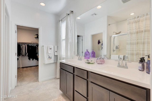 bathroom featuring vanity, an enclosed shower, and tile patterned flooring