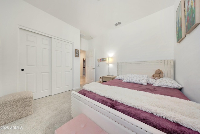 carpeted bedroom featuring a closet