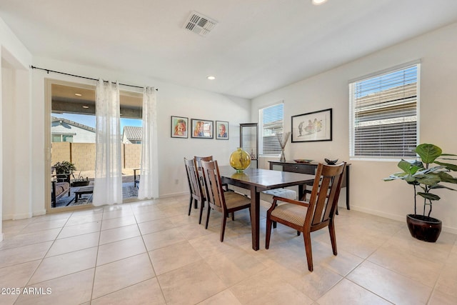 dining space with a healthy amount of sunlight and light tile patterned floors