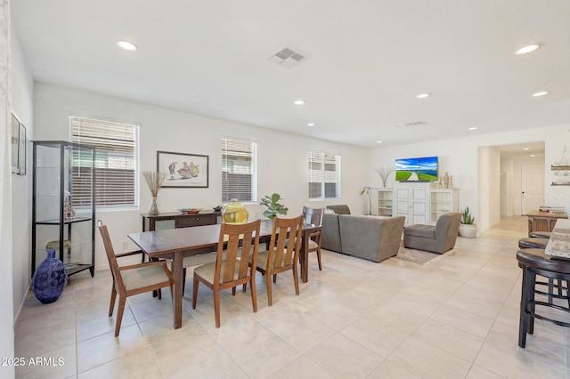 dining space with light tile patterned floors