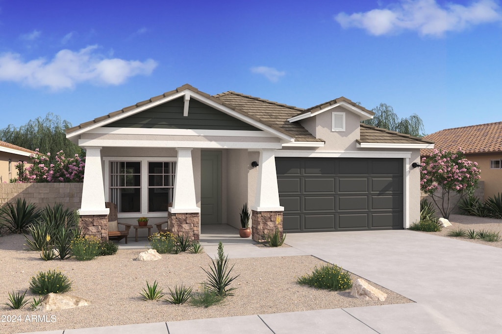 view of front of house with a porch and a garage