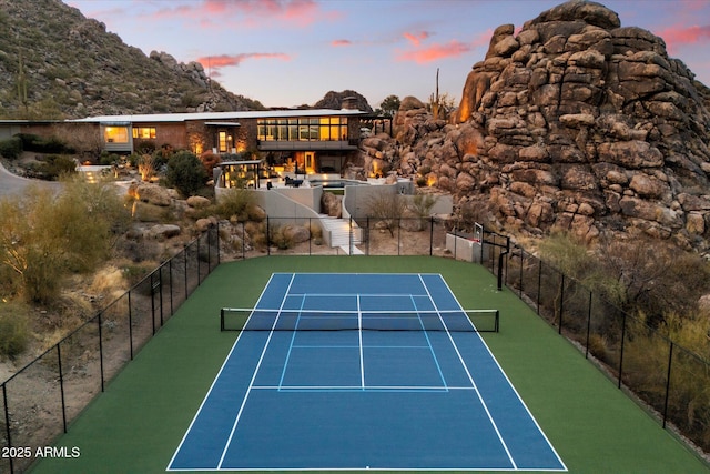 view of sport court with fence