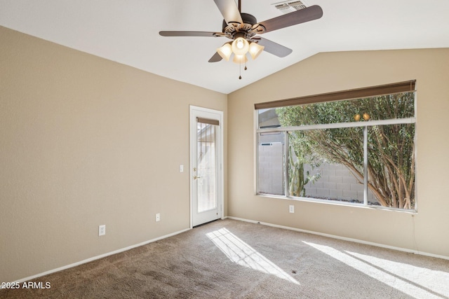 unfurnished room featuring carpet floors, vaulted ceiling, and ceiling fan