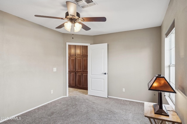 unfurnished bedroom with light carpet and ceiling fan