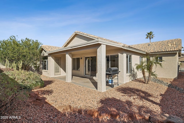 rear view of house with a patio