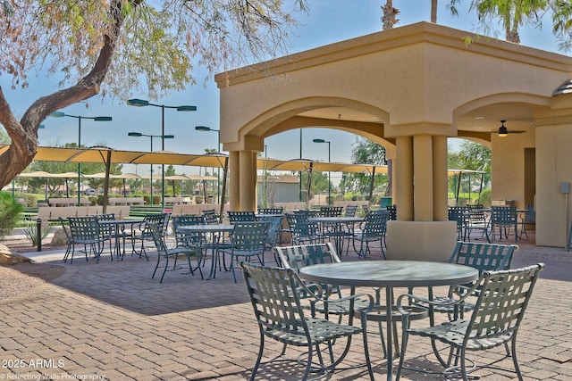 view of patio featuring ceiling fan