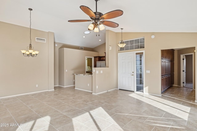 unfurnished living room with ceiling fan with notable chandelier and high vaulted ceiling