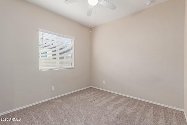 spare room featuring carpet flooring and ceiling fan