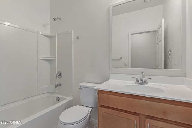 full bathroom featuring washtub / shower combination, vanity, and toilet