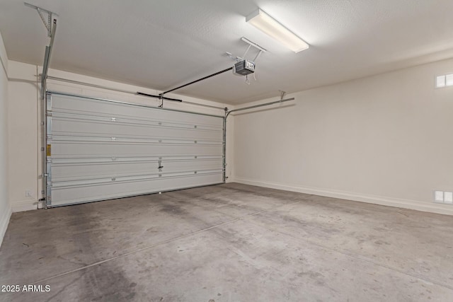 garage featuring a garage door opener