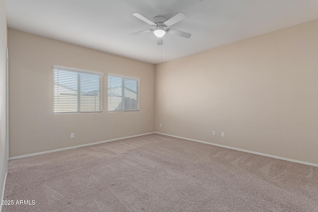 unfurnished room featuring light carpet and ceiling fan