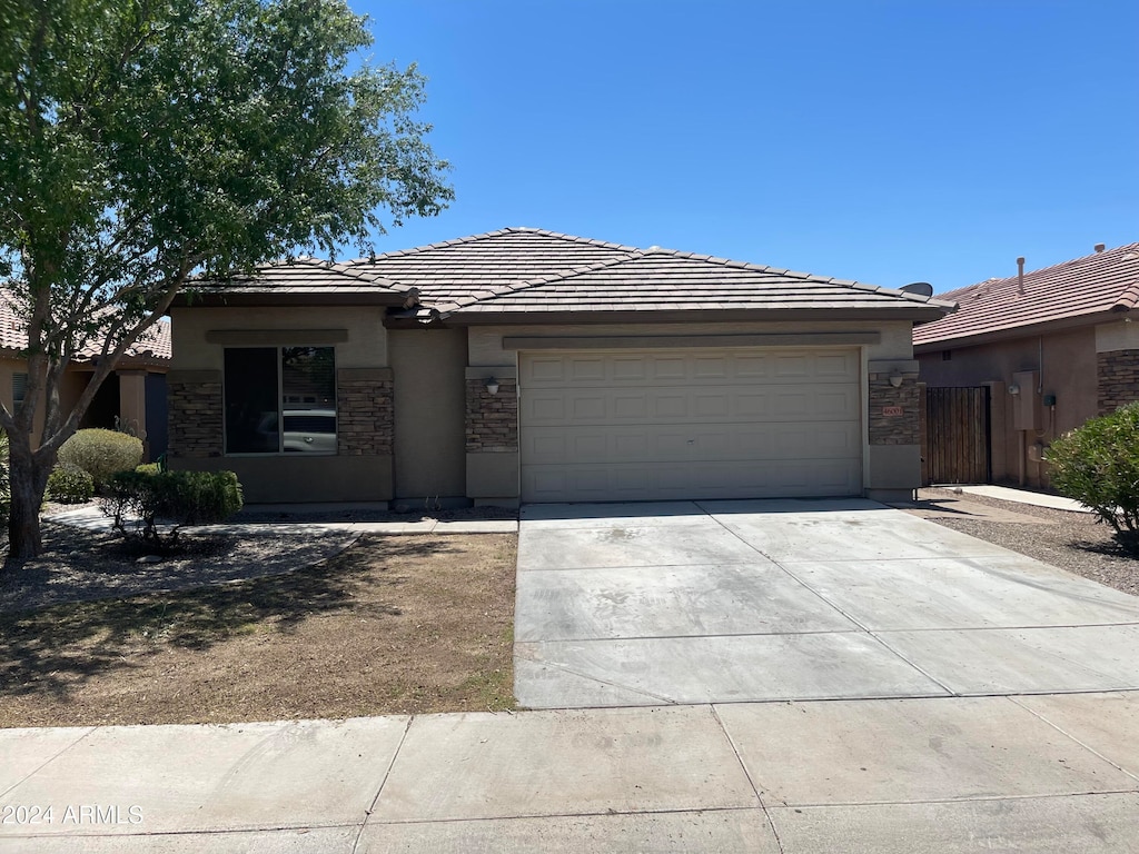 ranch-style home with a garage