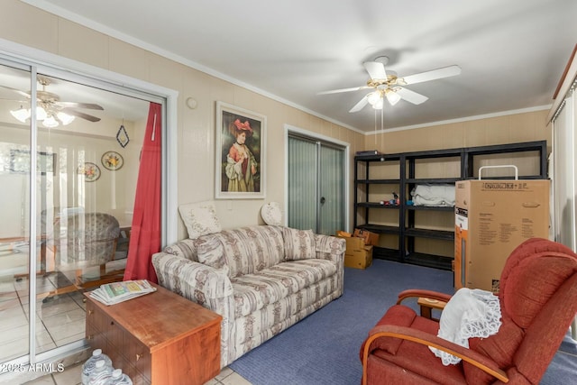 carpeted living room with crown molding and ceiling fan