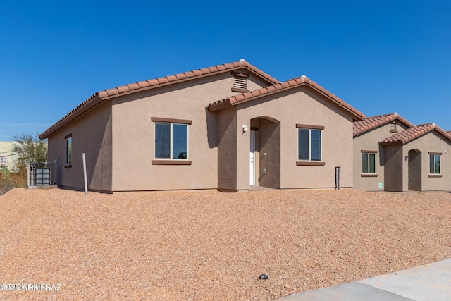 19 E Elm St, Tucson, AZ 85705 - mediterranean / spanish-style home with stucco siding and a tiled roof