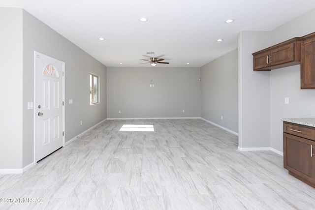 19 E Elm St, Tucson, AZ 85705 - unfurnished living room featuring ceiling fan, recessed lighting, and baseboards