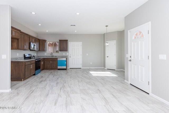 19 E Elm St, Tucson, AZ 85705 - kitchen featuring appliances with stainless steel finishes, a sink, recessed lighting, and baseboards