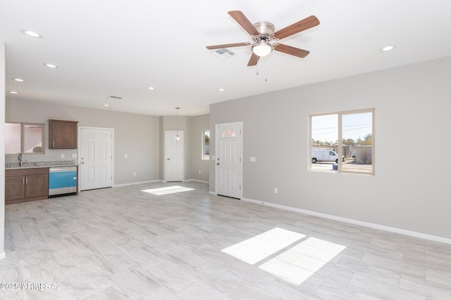 19 E Elm St, Tucson, AZ 85705 - unfurnished living room with recessed lighting, ceiling fan, and baseboards