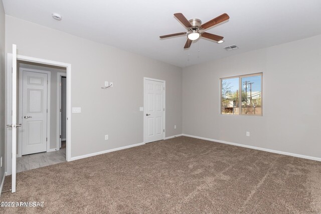 19 E Elm St, Tucson, AZ 85705 - unfurnished room featuring carpet, a ceiling fan, baseboards, and a smoke detector