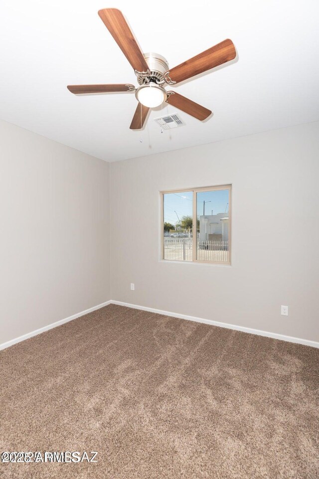 19 E Elm St, Tucson, AZ 85705 - carpeted spare room featuring baseboards and a ceiling fan