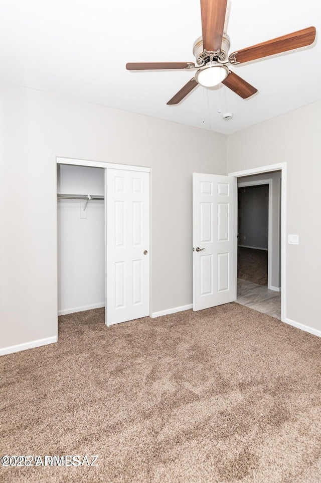 19 E Elm St, Tucson, AZ 85705 - unfurnished bedroom with carpet flooring, a closet, baseboards, and a ceiling fan