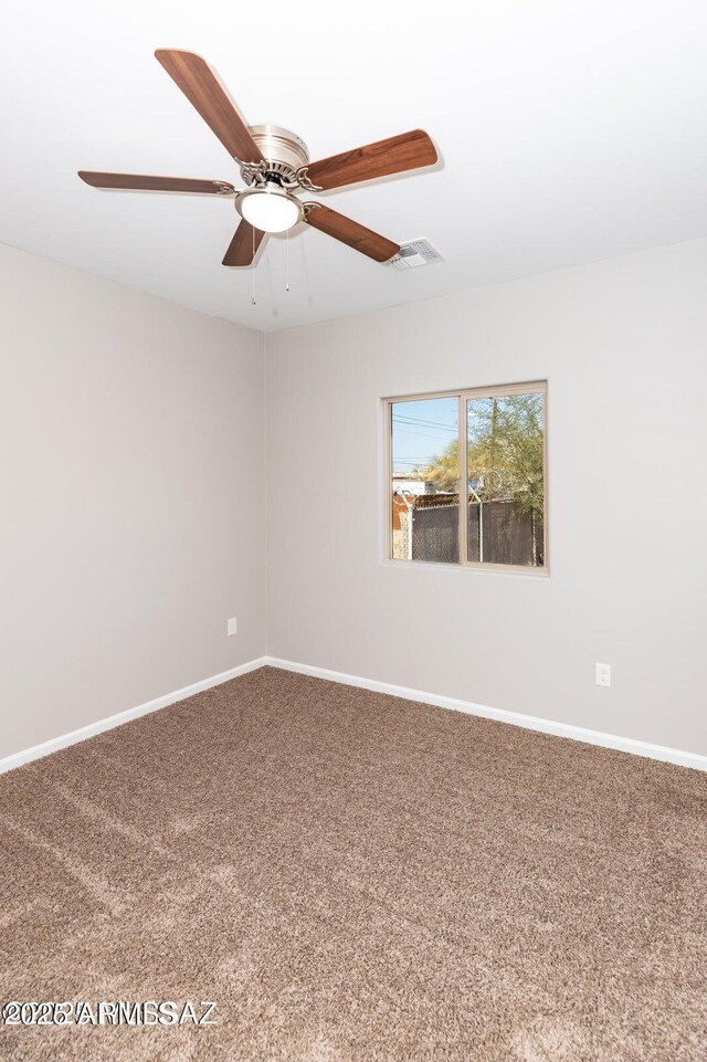 19 E Elm St, Tucson, AZ 85705 - carpeted spare room with baseboards and ceiling fan