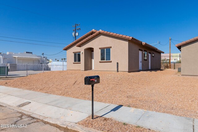 19 E Elm St, Tucson, AZ 85705 - single story home featuring a tiled roof and stucco siding
