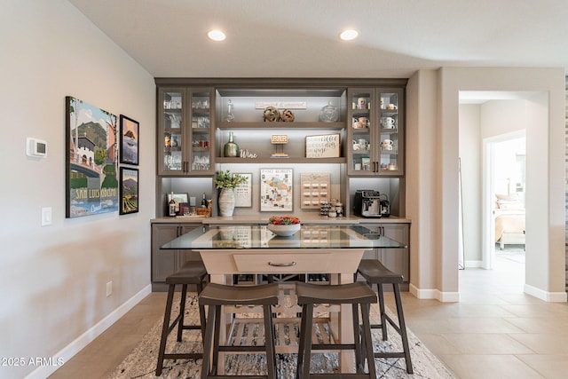 bar featuring dark brown cabinetry