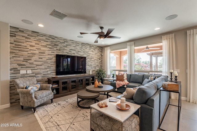 tiled living room featuring ceiling fan