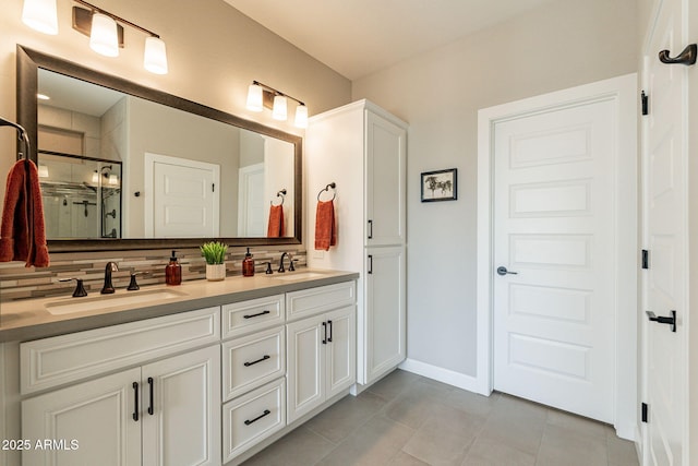 bathroom with vanity, decorative backsplash, tile patterned floors, and walk in shower