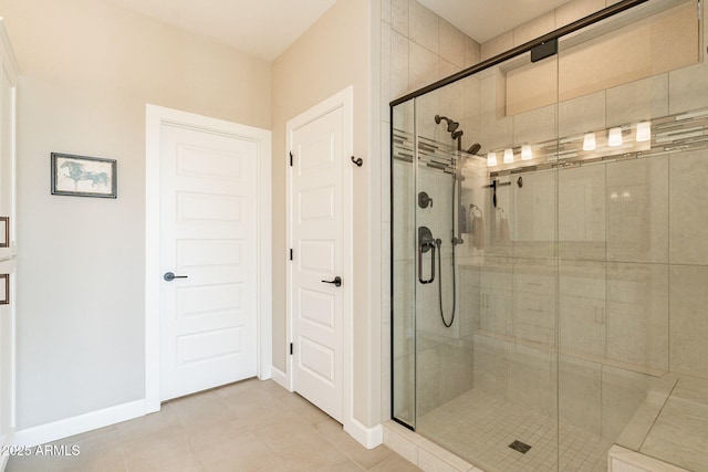 bathroom with walk in shower and tile patterned floors