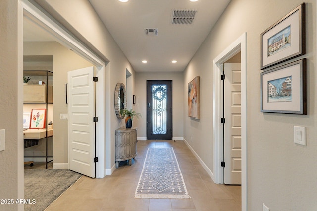 entrance foyer with light tile patterned floors