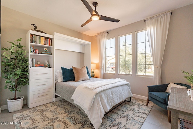 tiled bedroom with ceiling fan