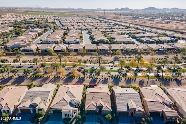 birds eye view of property with a mountain view