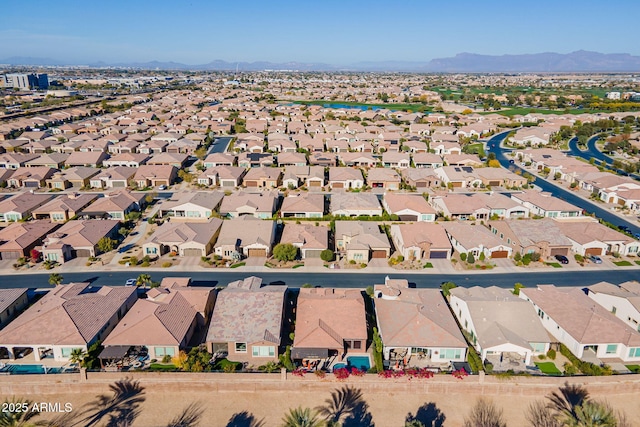 birds eye view of property featuring a mountain view