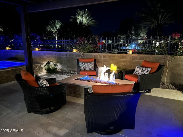 patio at twilight with an outdoor fire pit