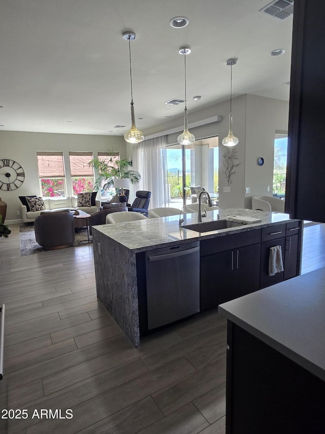 17833 E Veit Springs Dr, Rio Verde, AZ 85263 - kitchen featuring dark wood-style flooring, visible vents, stainless steel dishwasher, a sink, and an island with sink