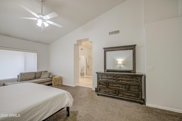 carpeted bedroom with connected bathroom, ceiling fan, high vaulted ceiling, baseboards, and visible vents