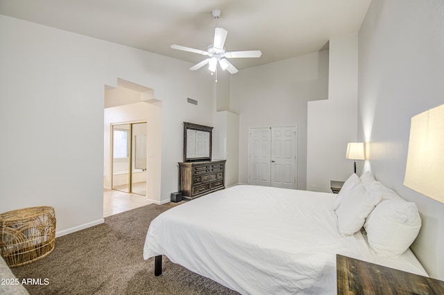 bedroom with visible vents, a ceiling fan, baseboards, high vaulted ceiling, and carpet flooring