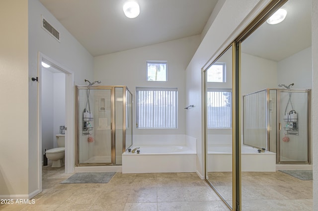 full bathroom featuring toilet, lofted ceiling, visible vents, a garden tub, and a stall shower