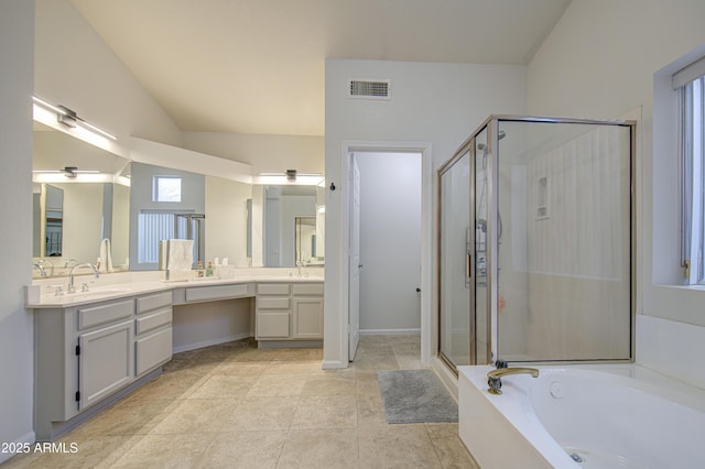 full bath featuring double vanity, a garden tub, visible vents, a stall shower, and a sink
