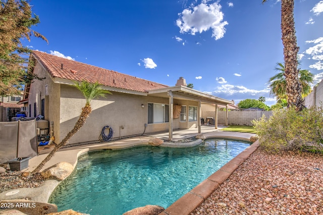 view of swimming pool with a fenced in pool, a fenced backyard, and a patio area