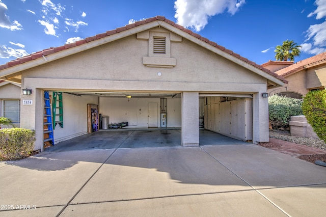 garage with concrete driveway