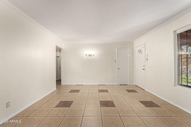 unfurnished room featuring ornamental molding and light tile patterned floors