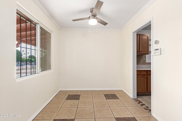 tiled spare room featuring crown molding and ceiling fan