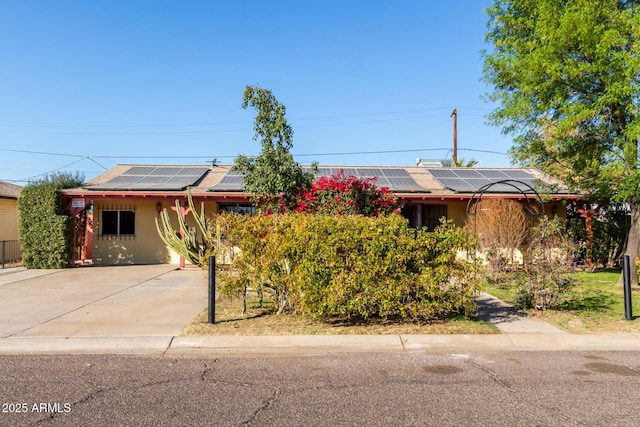 view of front of house with solar panels