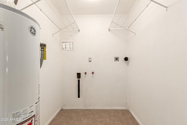 laundry room featuring light tile patterned floors, hookup for a washing machine, water heater, and hookup for an electric dryer