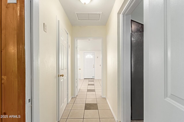 hallway featuring light tile patterned floors