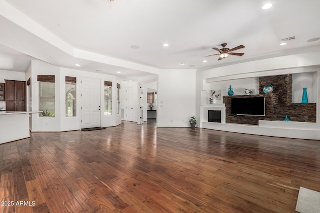 30135 N 129th Gln, Peoria, AZ 85383 - unfurnished living room with ceiling fan, wood finished floors, recessed lighting, and a fireplace