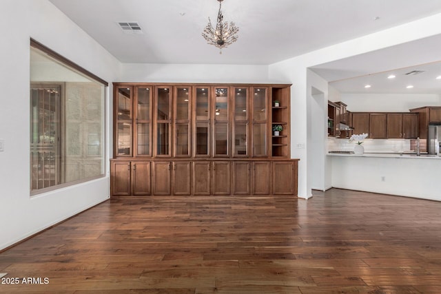30135 N 129th Gln, Peoria, AZ 85383 - unfurnished living room featuring dark wood-style floors, a chandelier, and recessed lighting