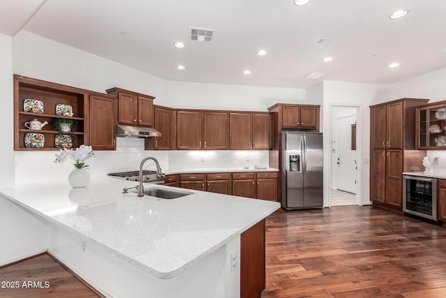 30135 N 129th Gln, Peoria, AZ 85383 - kitchen with stainless steel fridge, beverage cooler, a sink, under cabinet range hood, and a peninsula